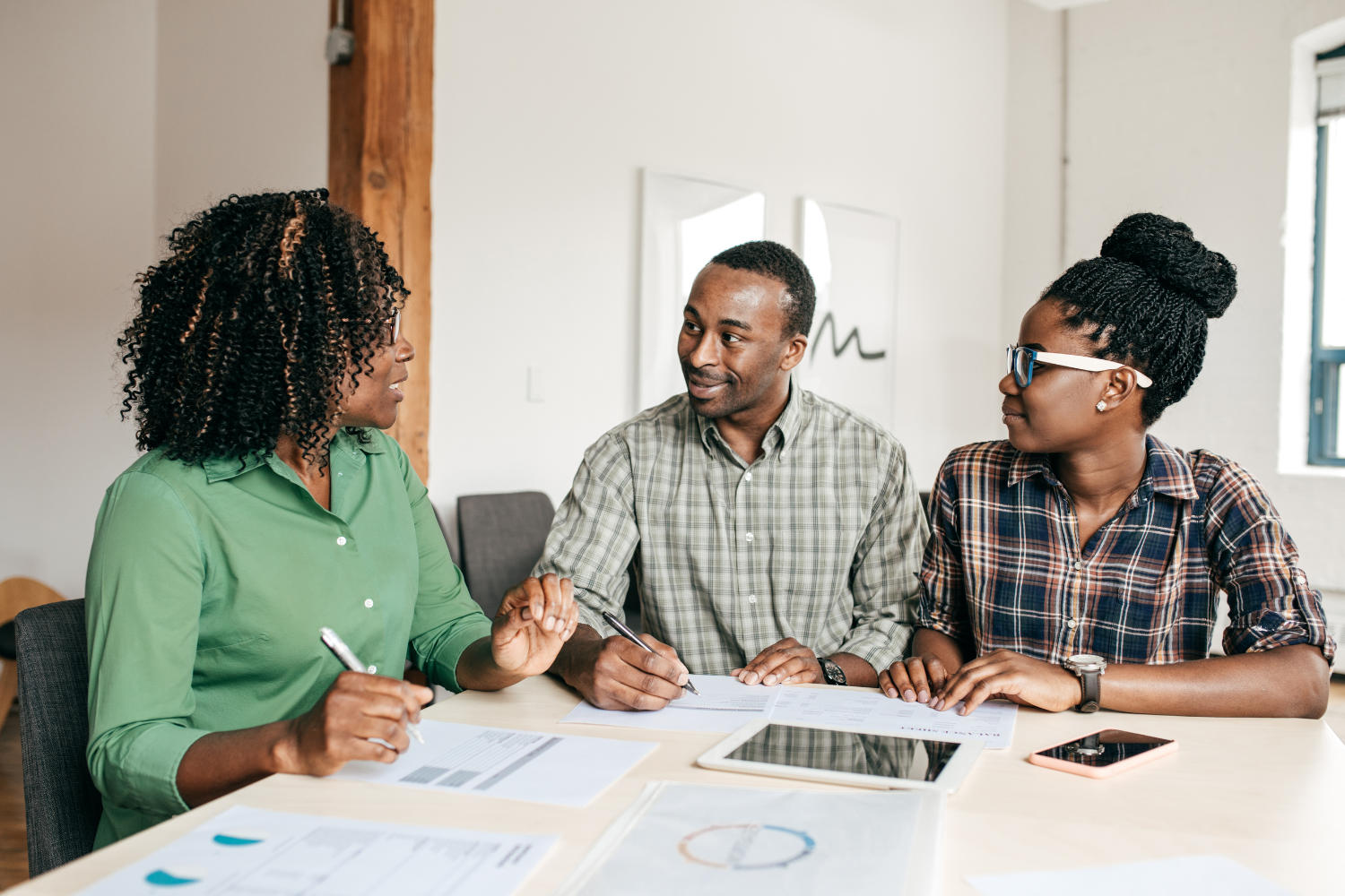 Family at table looking at financial documents